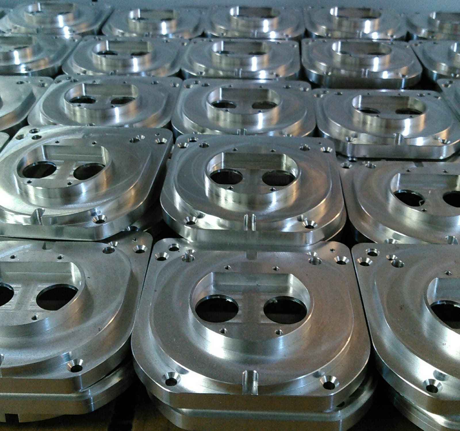 High-volume production run of machined aluminum housing plates