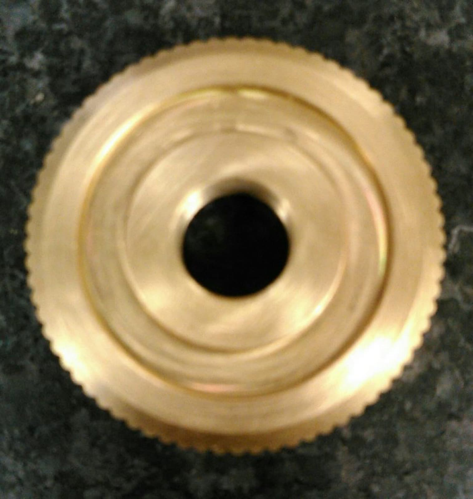 Knurled brass turned component with bored center